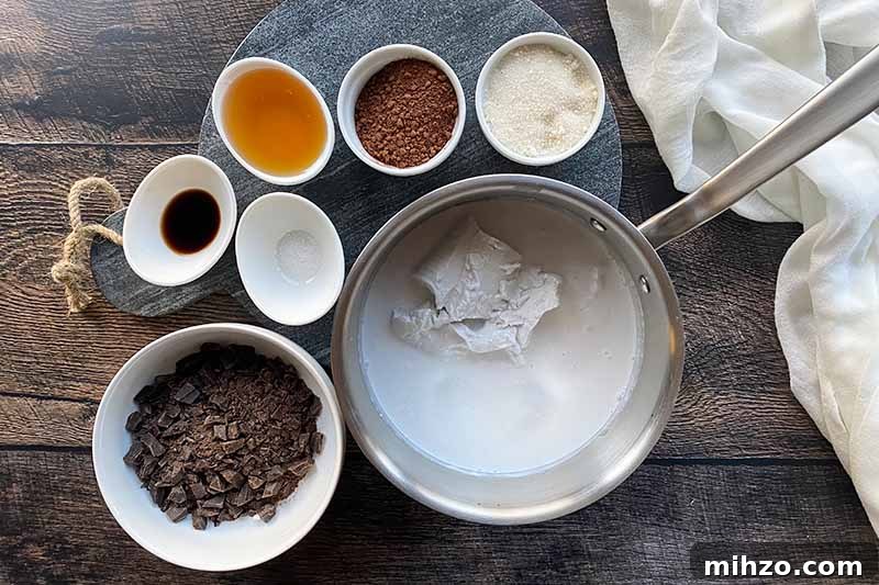 Horizontal image of measured wet and dry dessert ingredients in bowls and a pot.