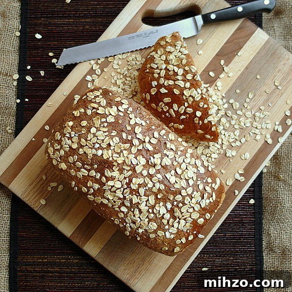 Old Neighborhood Oatmeal Porter Beer Bread Recipe 3 A loaf of old neighborhood oatmeal porter beer bread with oatmeal scattered on top.