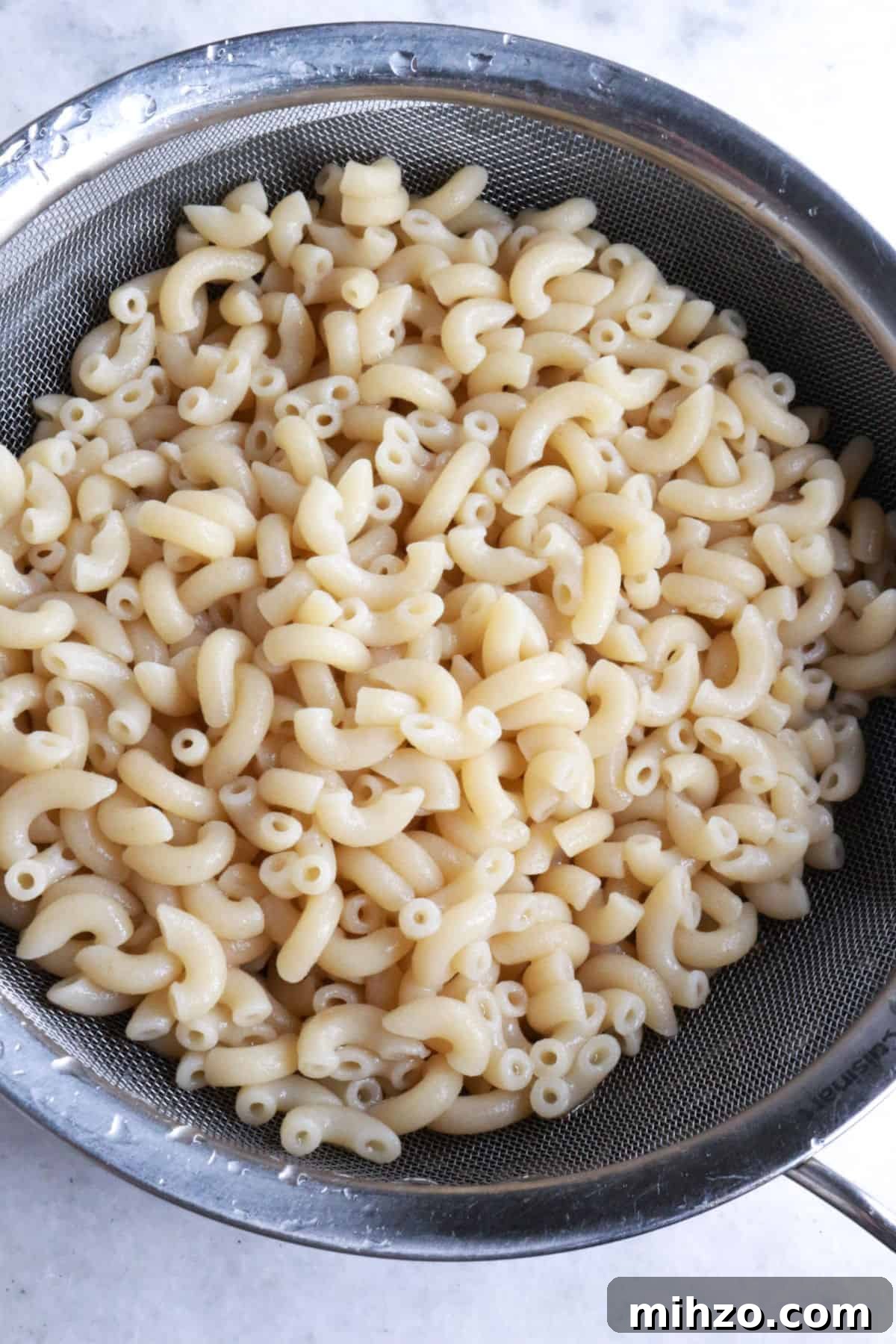 Mexican Macaroni Pasta Salad with Creamy Dressing 5 Draining macaroni noodles in a sieve