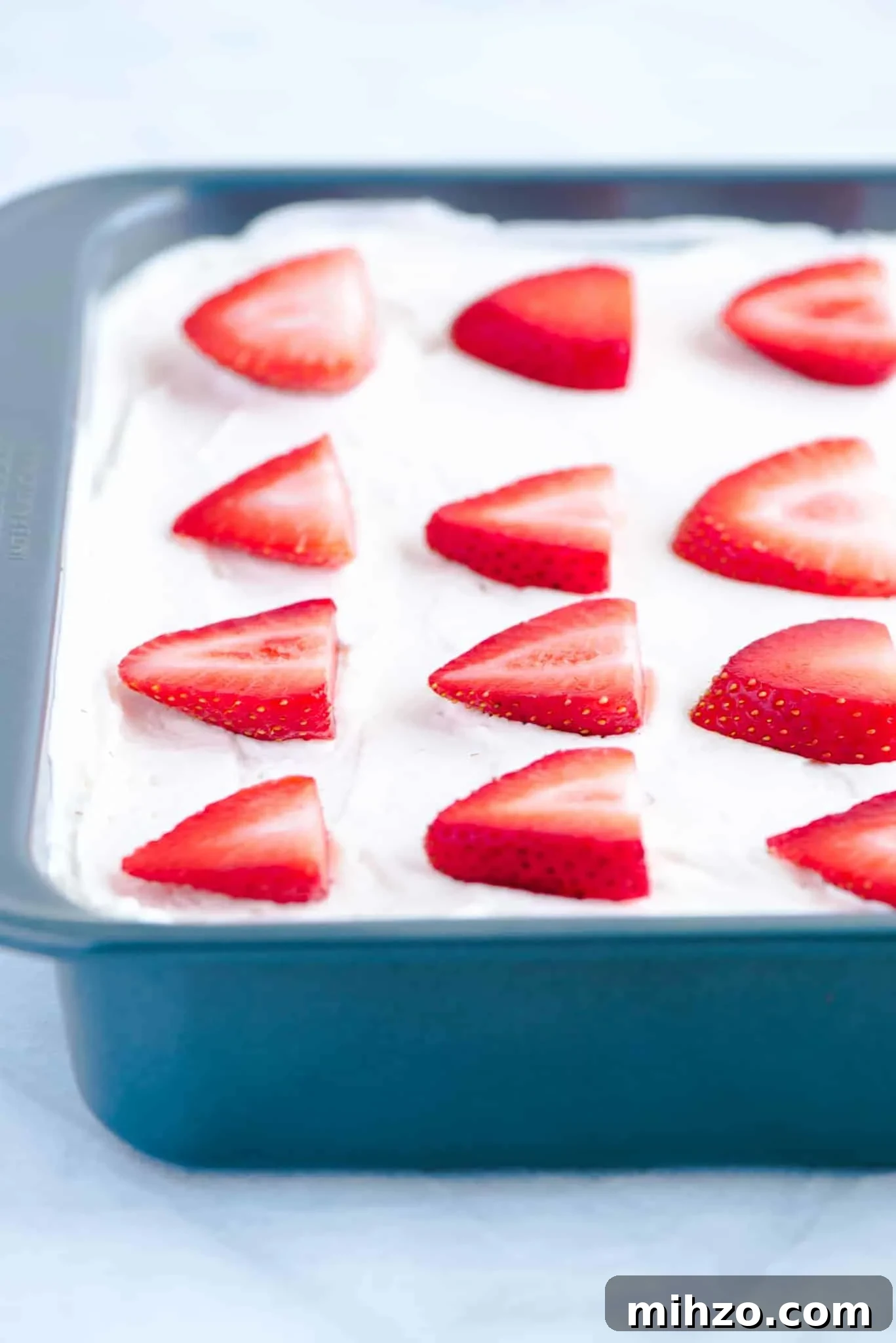 Gluten-Free Strawberry Icebox Cake Recipe for Summer Parties 4 Gluten Free Strawberry Icebox Cake in a metal 9x9 pan