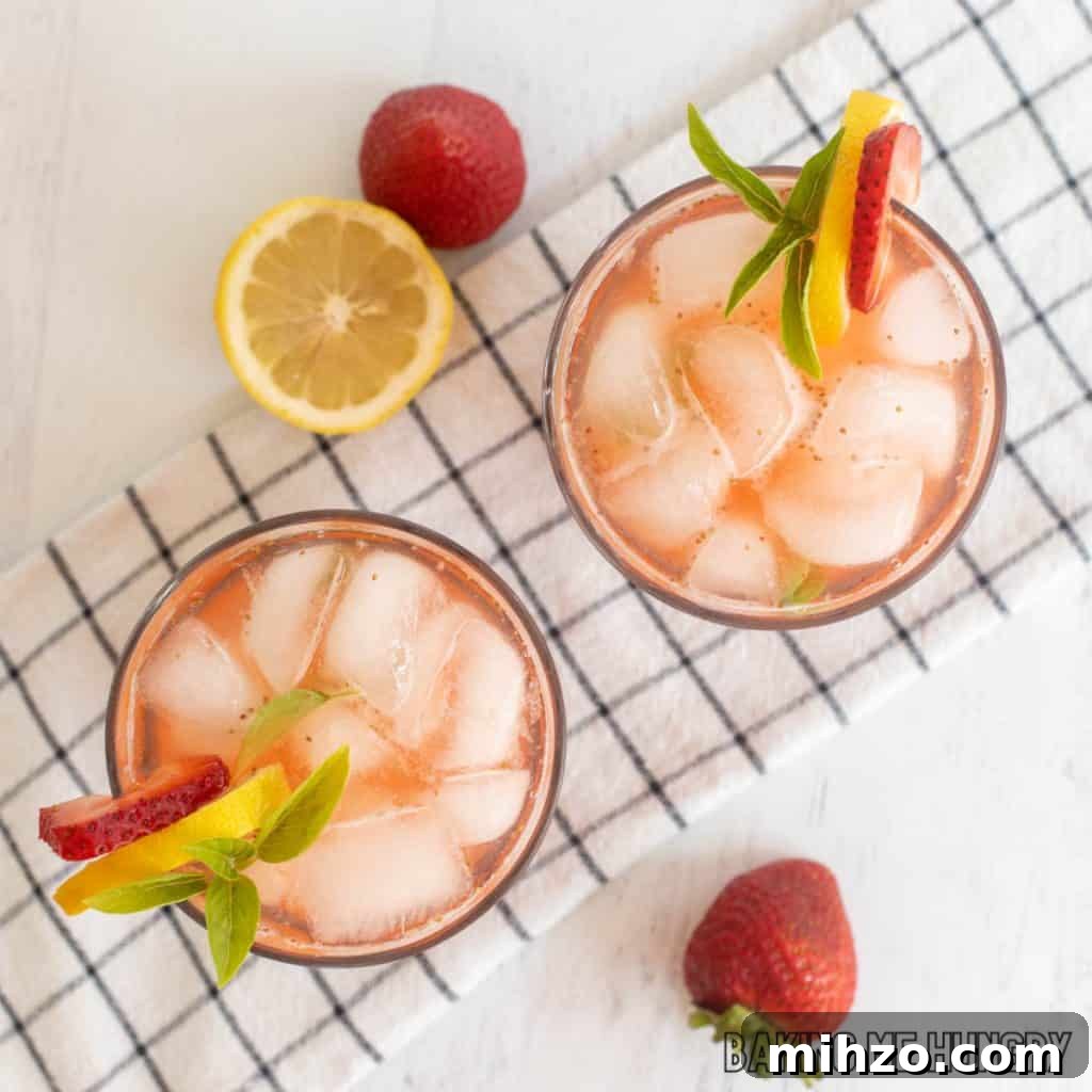 Strawberry Basil Lemonade Recipe: Refreshing Summer Drink 3 overhead shot of two glasses with strawberry basil lemonade