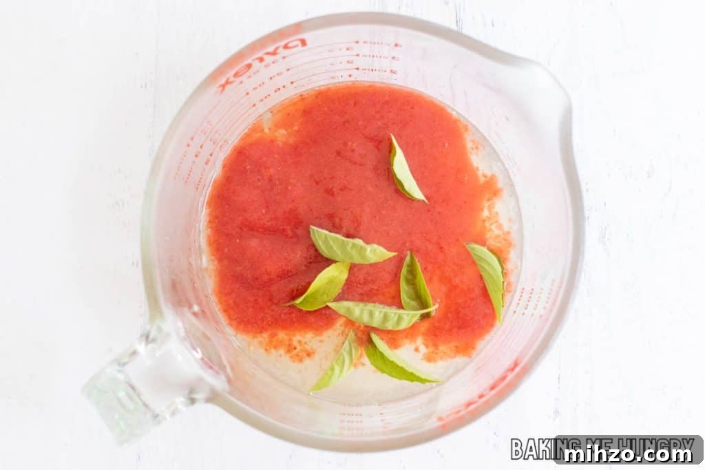 Strawberry Basil Lemonade Recipe: Refreshing Summer Drink 7 overhead shot of the combined ingredients in glass measuring cup