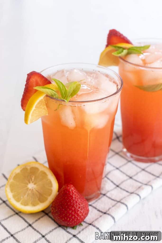 Strawberry Basil Lemonade Recipe: Refreshing Summer Drink 10 strawberry basil lemonade recipe in two glasses with garnish