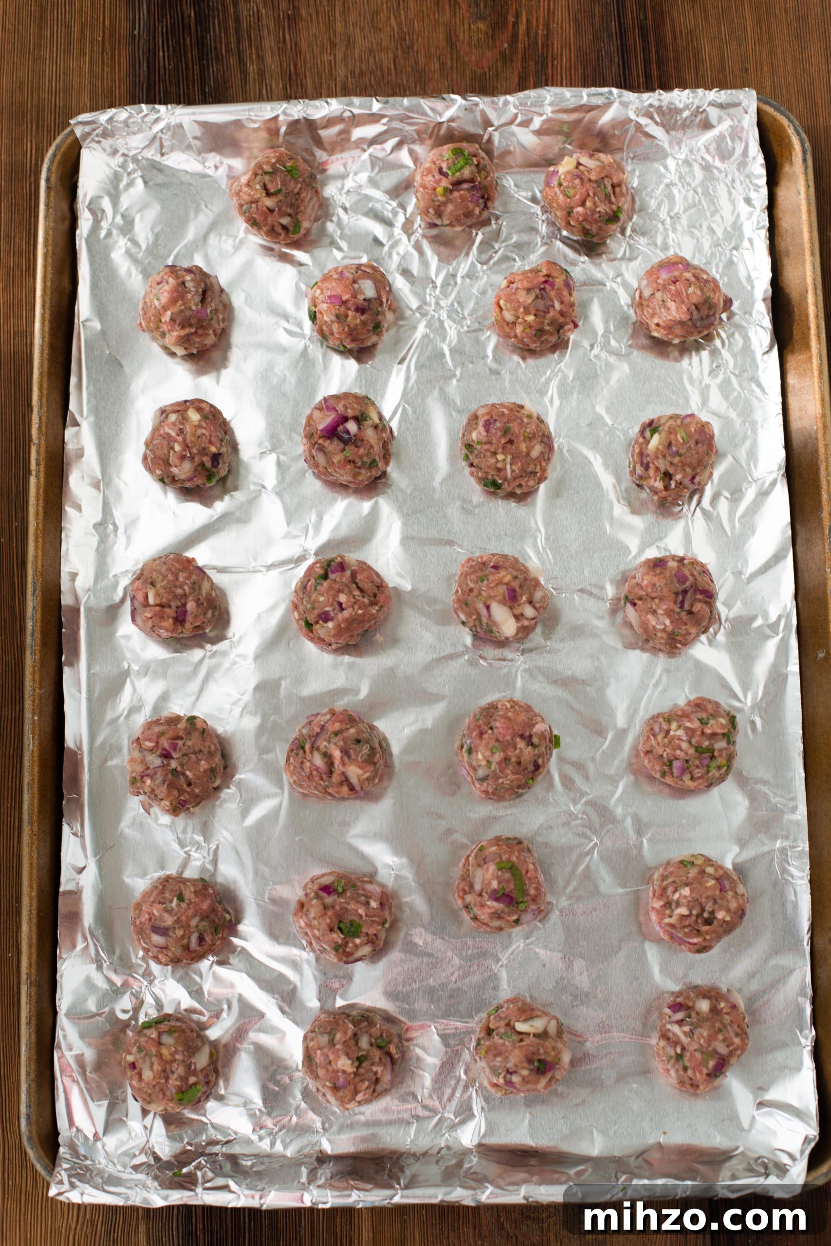 Vietnamese Pork Meatballs Recipe: Classic Nem Nuong Guide 5 Vietnamese Meatballs on pan