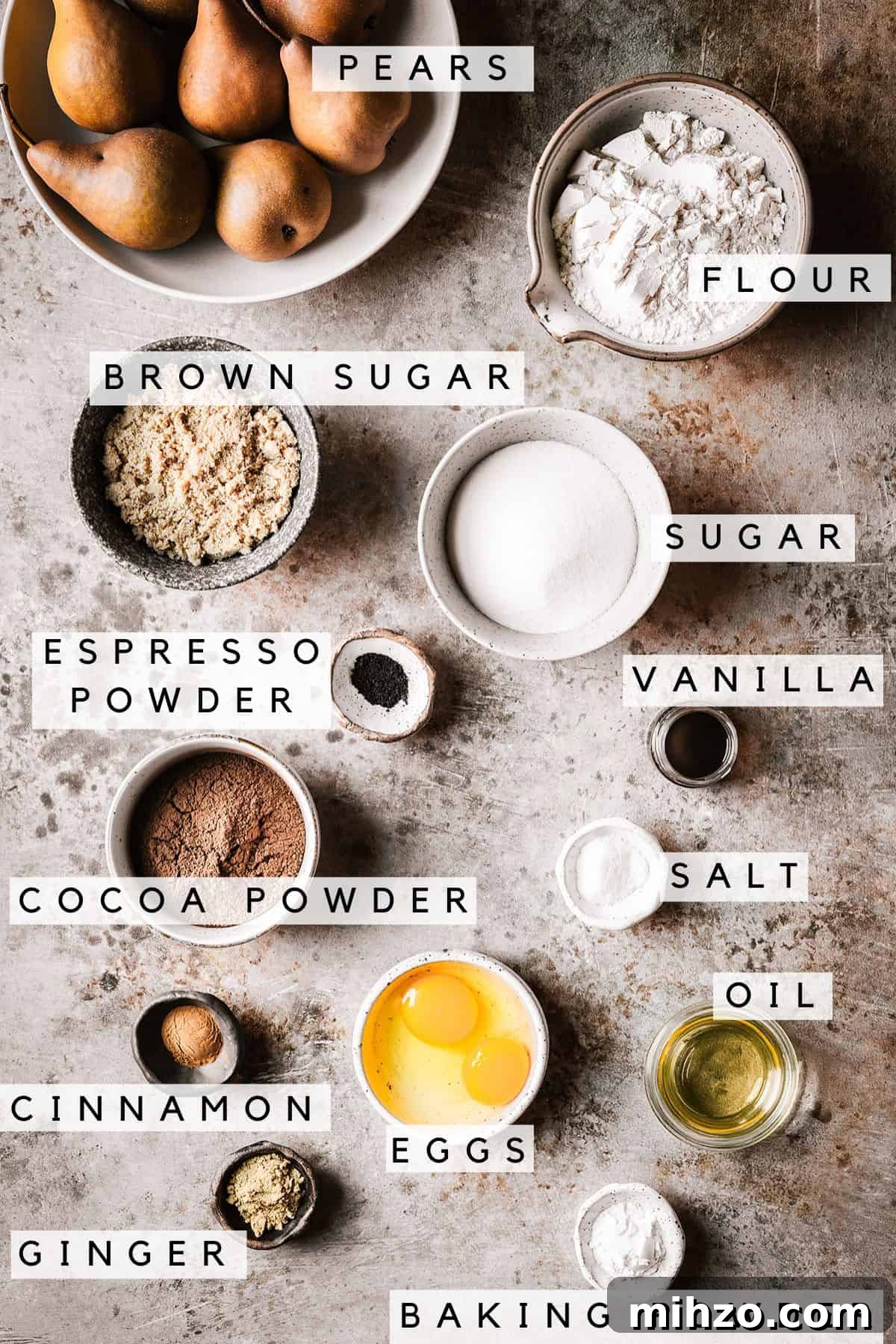 Containers of ingredients for chocolate pear cake with labels.