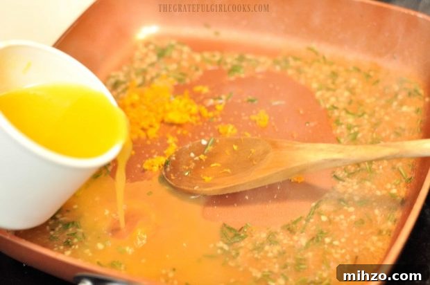 Orange juice being added to skillet for glaze.