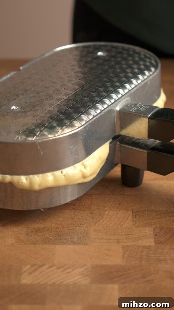 Pizzelle Recipe: Traditional Italian Waffle Cookies Guide 6 A little bit of runoff from the pizzelle press