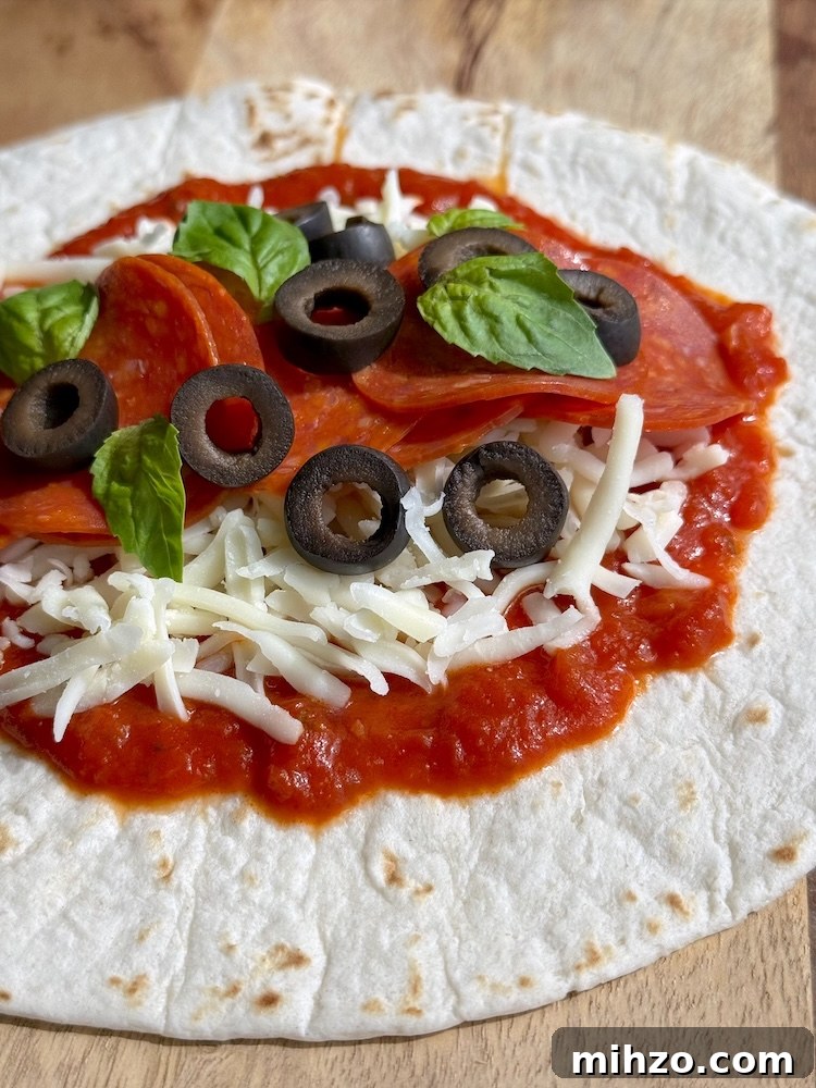 How to Make Pizza Burritos at Home — Fusion Recipe and Tips 5 A fun and easy dinner idea for busy weeknights. How to make pizza in flour tortillas!