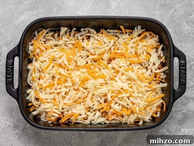 Spicy Chorizo Quiche Squares Recipe for Brunch or Parties 6 Layers of chorizo and cheese for sausague quiche squares.