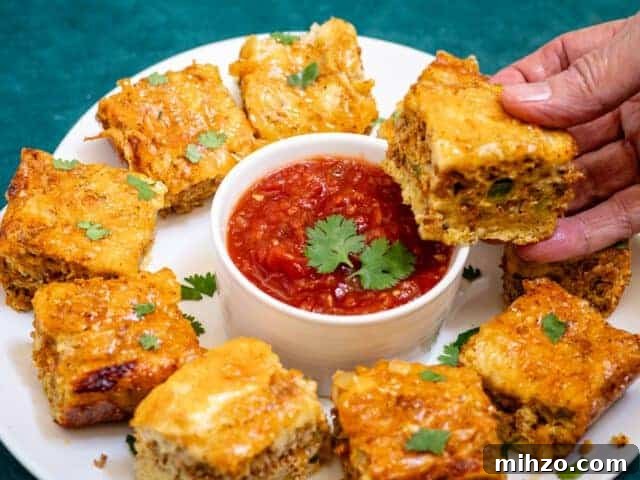 Spicy Chorizo Quiche Squares Recipe for Brunch or Parties 9 Chorizo quiche squares. on a platter with salsa and cilantro.