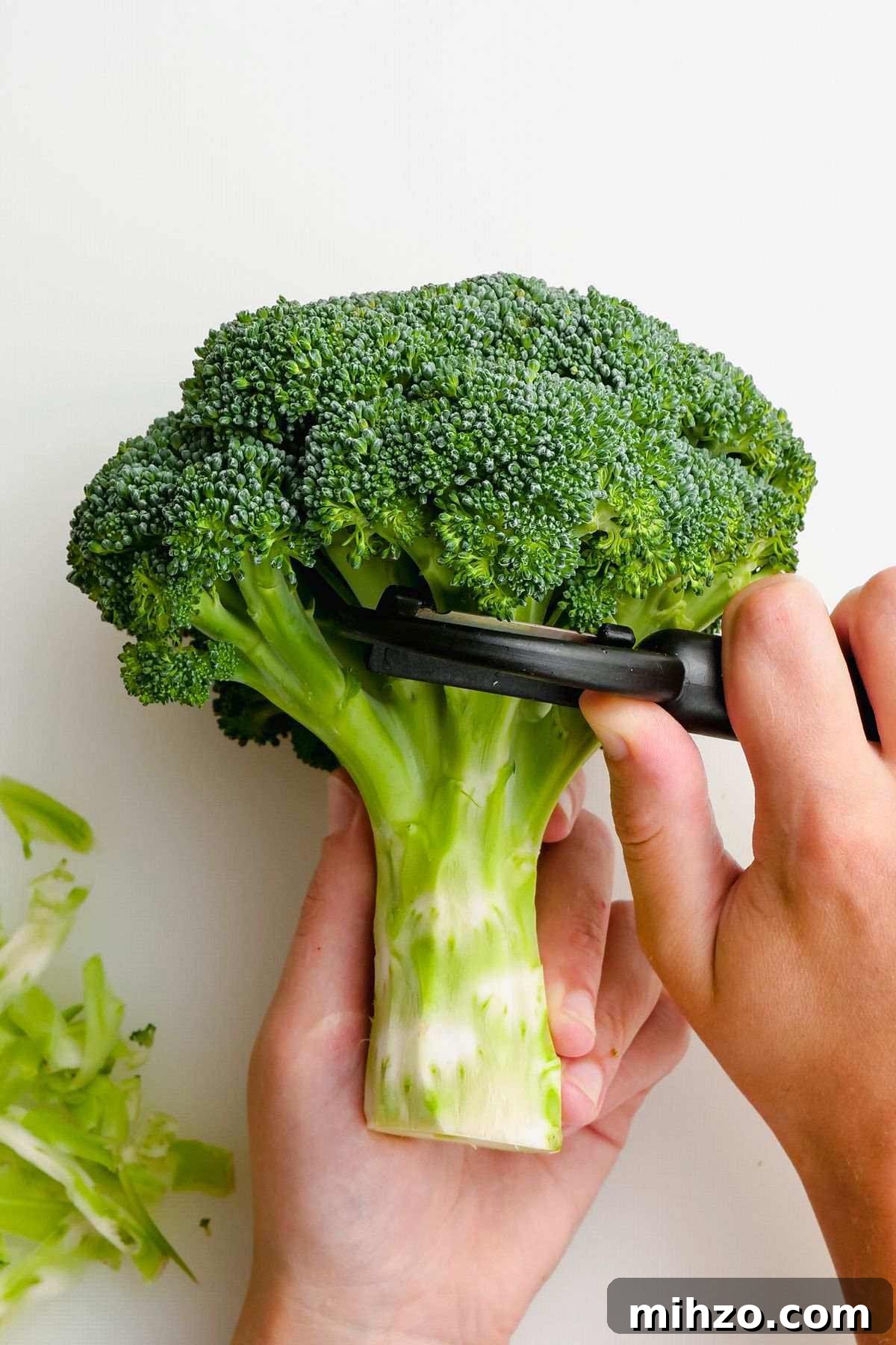 Blanch Broccoli Quickly: Perfectly Crisp, Bright Green Every Time 3 peeling the outside of the broccoli