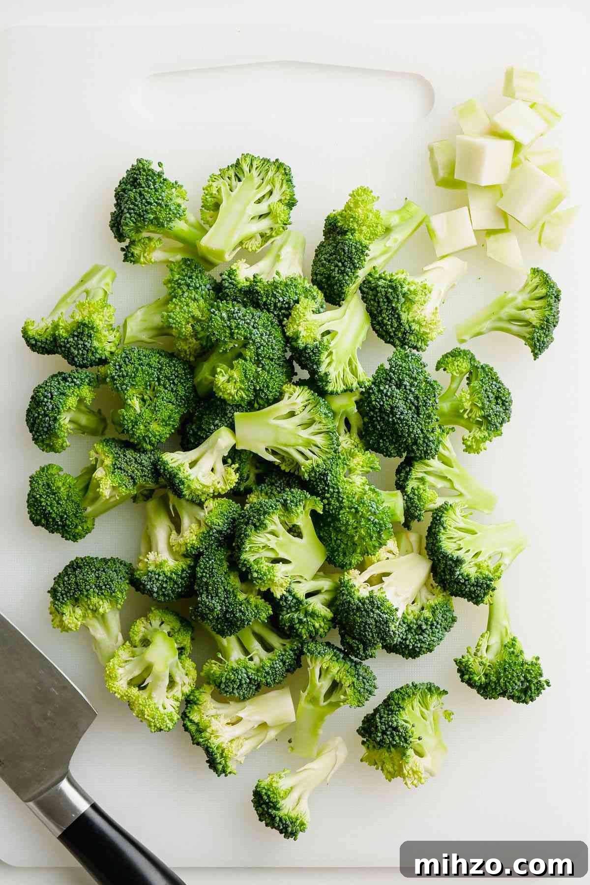 Blanch Broccoli Quickly: Perfectly Crisp, Bright Green Every Time 5 head of broccoli cut into florets on white cutting board