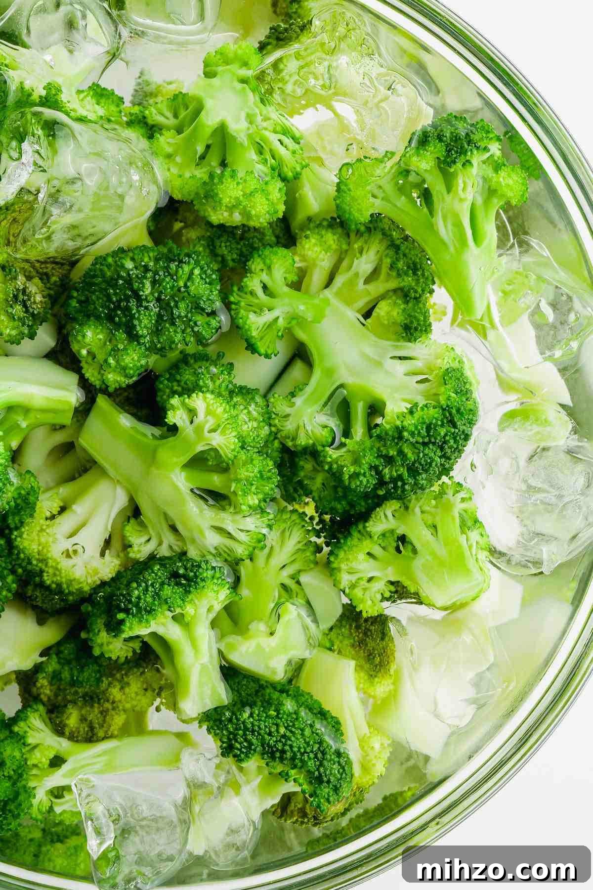 Blanch Broccoli Quickly: Perfectly Crisp, Bright Green Every Time 8 blanched broccoli florets in bowl of ice water