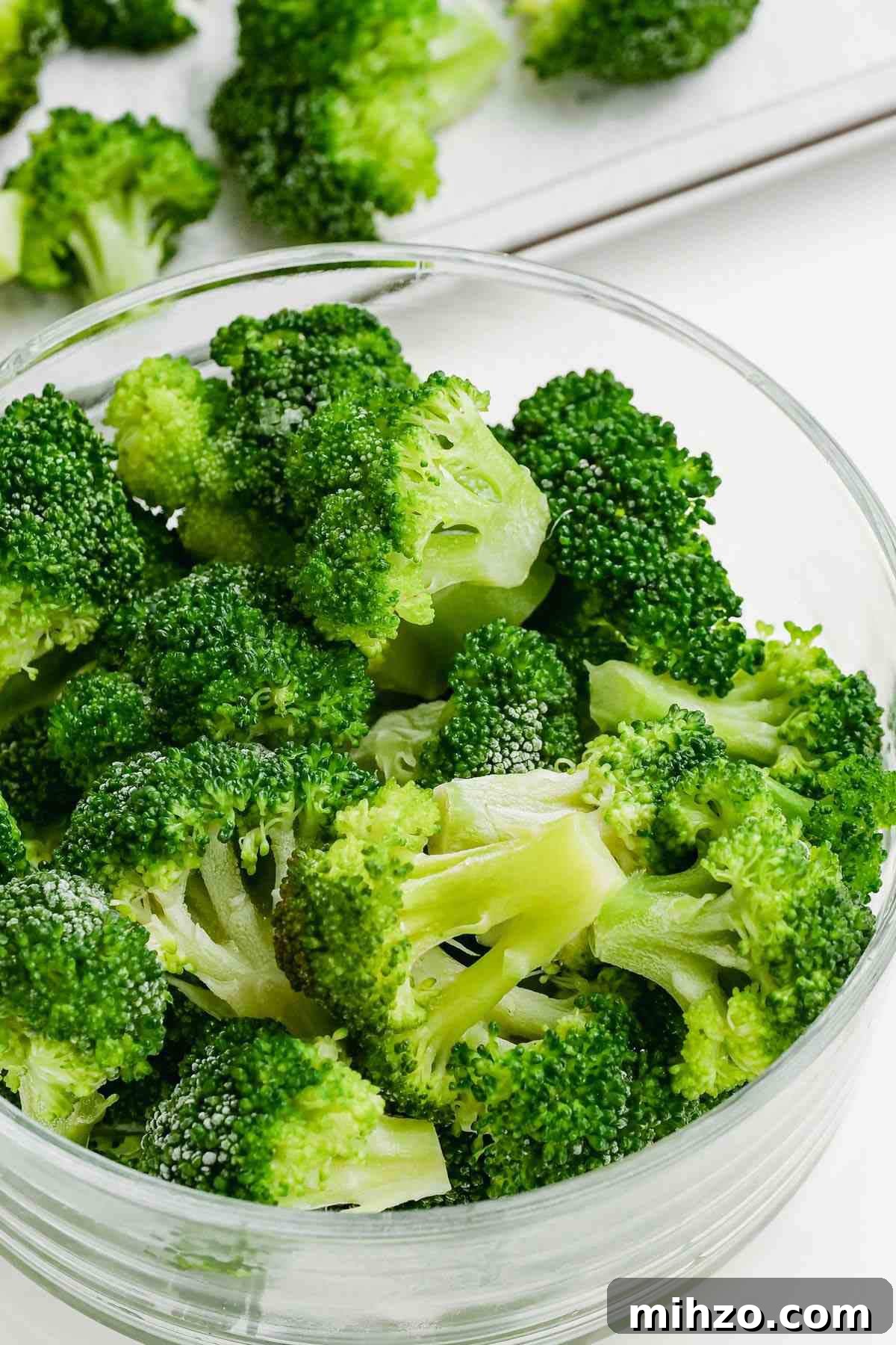 Blanch Broccoli Quickly: Perfectly Crisp, Bright Green Every Time 10 photo of vivid green blanched broccoli florets in a glass bowl