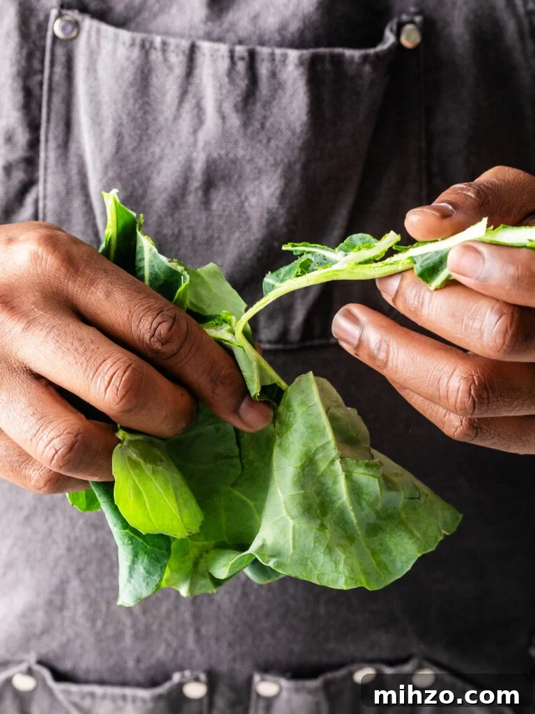 Savory Collard Greens with Smoked Ham Hocks Recipe 6 removing collard greens from the stems