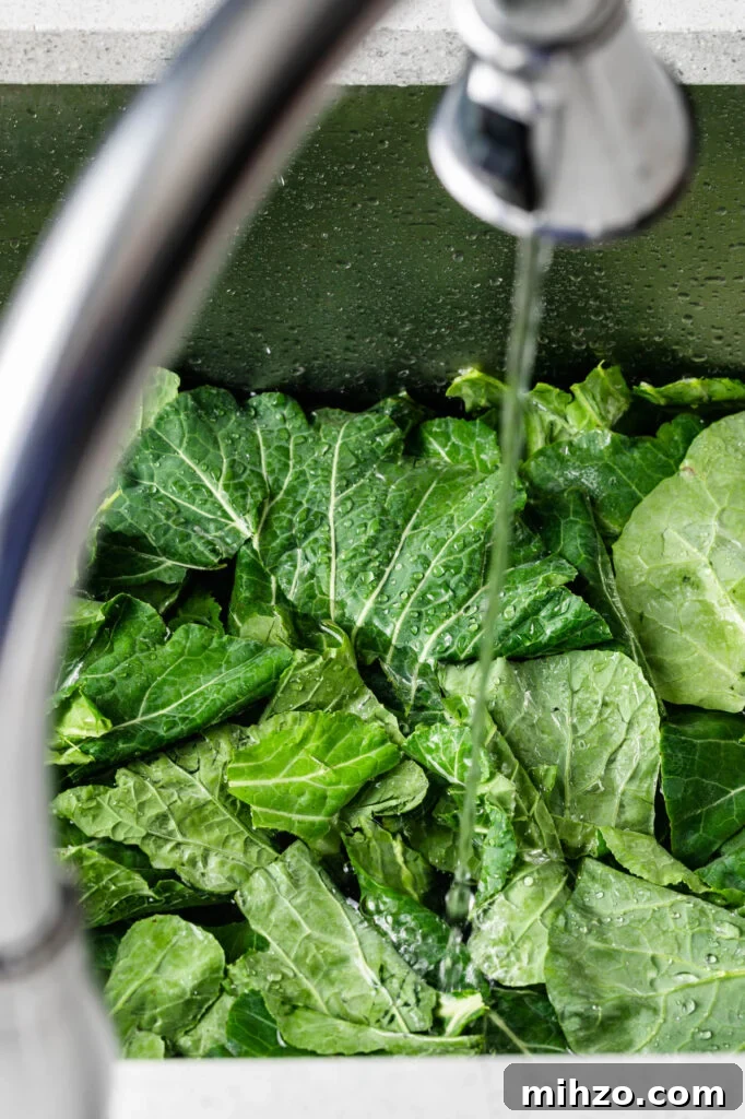 Savory Collard Greens with Smoked Ham Hocks Recipe 8 washing collard greens in the sink