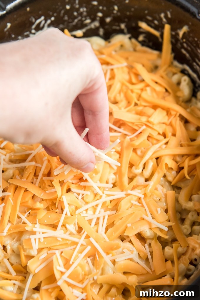 Creamy Slow Cooker Macaroni and Cheese Recipe 6 add cheese to crockpot