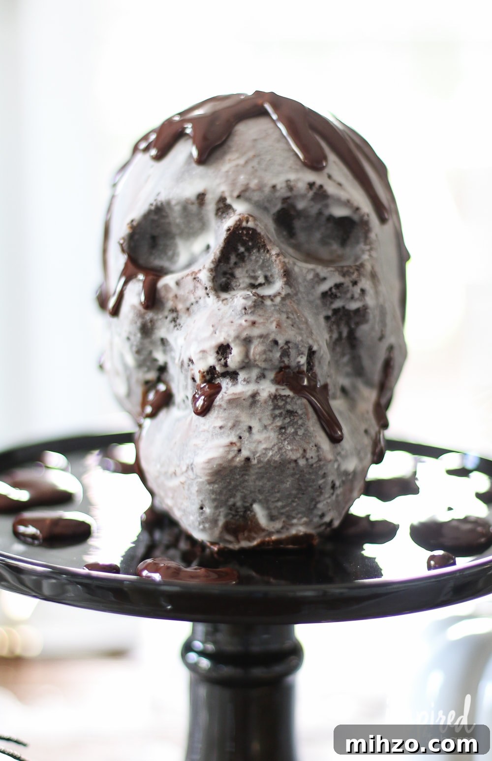 Chocolate Skull Cake Recipe: Decadent Layered Halloween Dessert 2 Chocolate Skull Cake on a black cake stand.