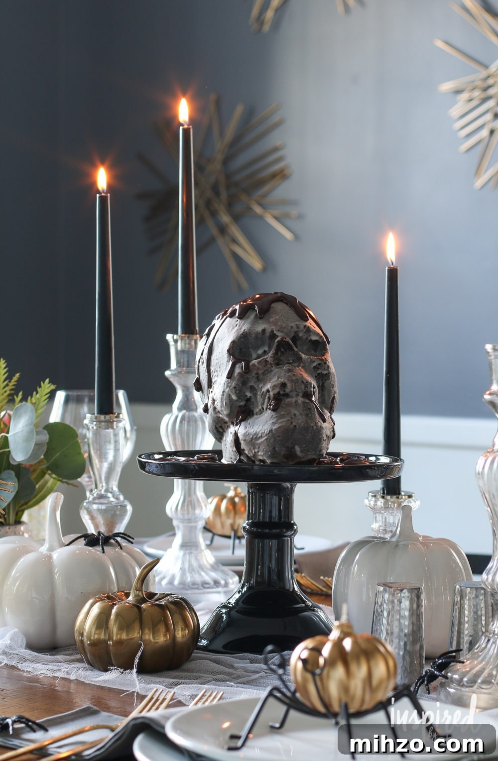 Chocolate Skull Cake Recipe: Decadent Layered Halloween Dessert 3 chocolate skull cake on a table styled for Halloween.