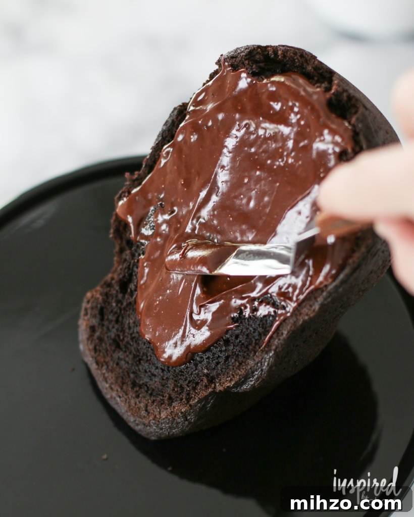 Chocolate Skull Cake Recipe: Decadent Layered Halloween Dessert 8 Assembling a Chocolate Skull Cake with chocolate frosting.