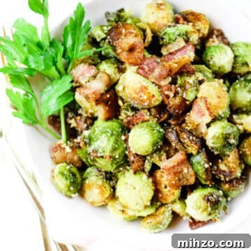 Brussel Sprouts roasted with bacon on white platter