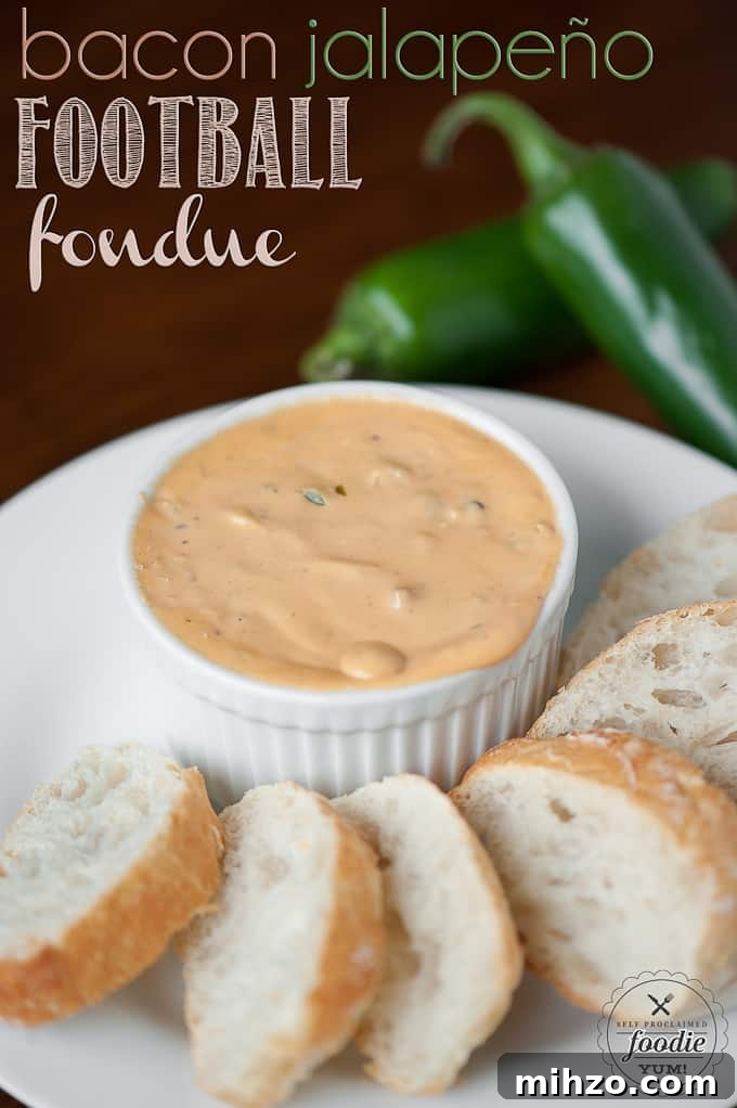 Bacon Jalapeño Football Fondue Recipe for Game Day Parties 2 bacon jalapeno cheese sauce in dish with slices of bread