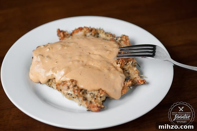Bacon Jalapeño Football Fondue Recipe for Game Day Parties 4 breaded chicken breast covered in cheese sauce on plate