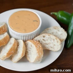 Bacon Jalapeño Football Fondue Recipe for Game Day Parties 5 Crisp bacon, spicy fresh jalapeno, and beer make this Bacon Jalapeño Football Fondue an absolute game day favorite and is everything comfort food should be.