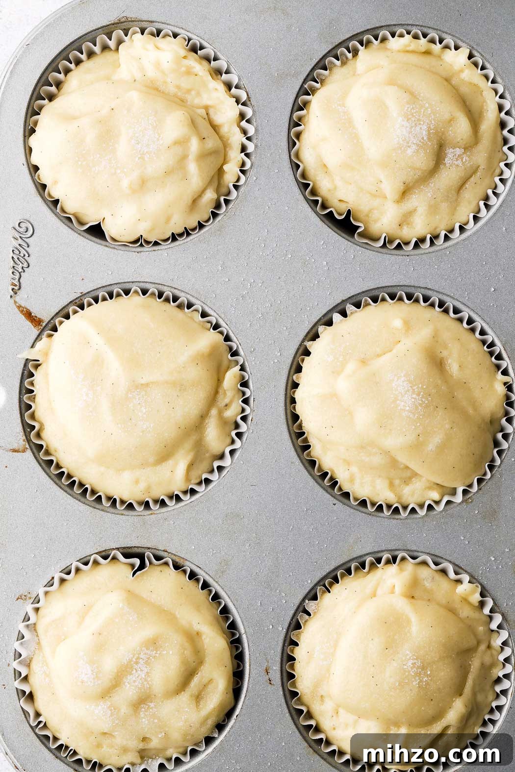 Ultimate Homemade Vanilla Muffins Recipe 7 fill muffin tins all the way and top with sugar