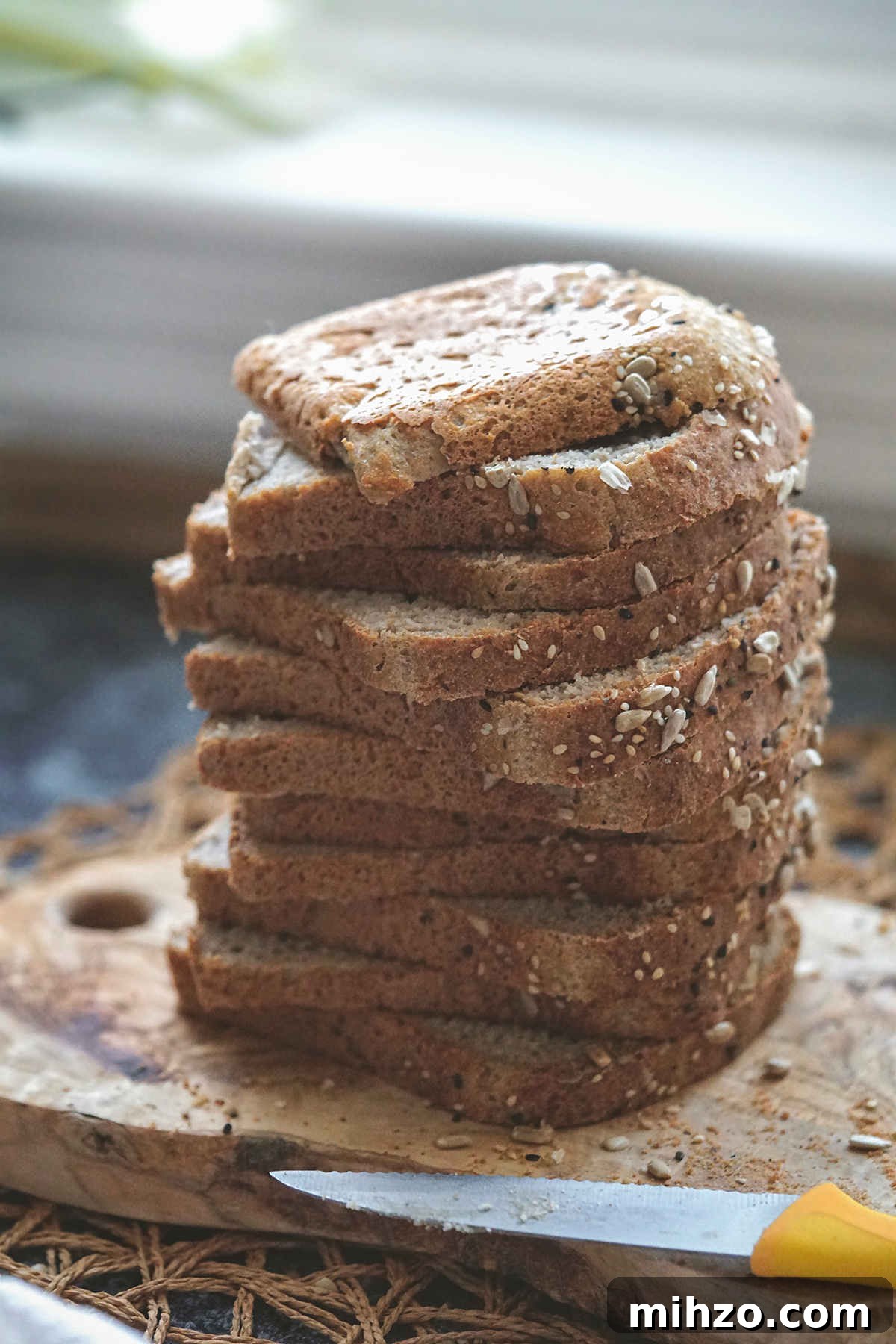 Soft Gluten-Free, Dairy-Free Buckwheat Bread Recipe 10 Sliced buckwheat flour bread, slices staked on a board.