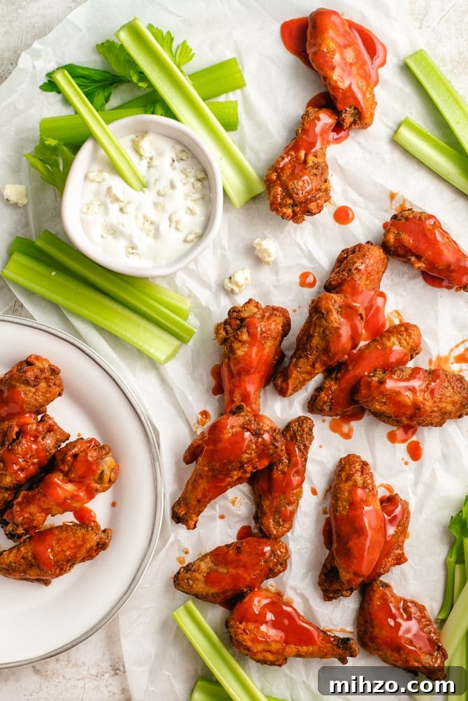 These Crispy Baked Chicken Wings are so shatteringly crisp that your guests will hardly believe that they’ve never been battered, breaded, or fried. This healthier and hassle-free recipe is a major must-make recipes for parties, and it’s all thanks to one simple, special ingredient.| hostthetoast.com img 13878 1
