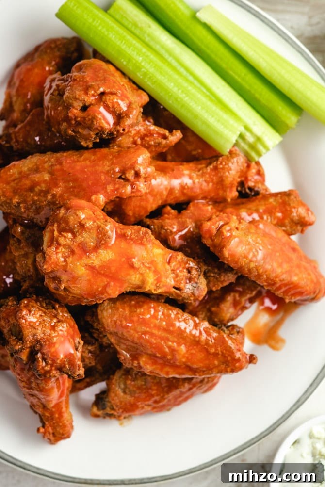 These Crispy Baked Chicken Wings are so shatteringly crisp that your guests will hardly believe that they’ve never been battered, breaded, or fried. This healthier and hassle-free recipe is a major must-make recipes for parties, and it’s all thanks to one simple, special ingredient. | hostthetoast.com img 13878 2