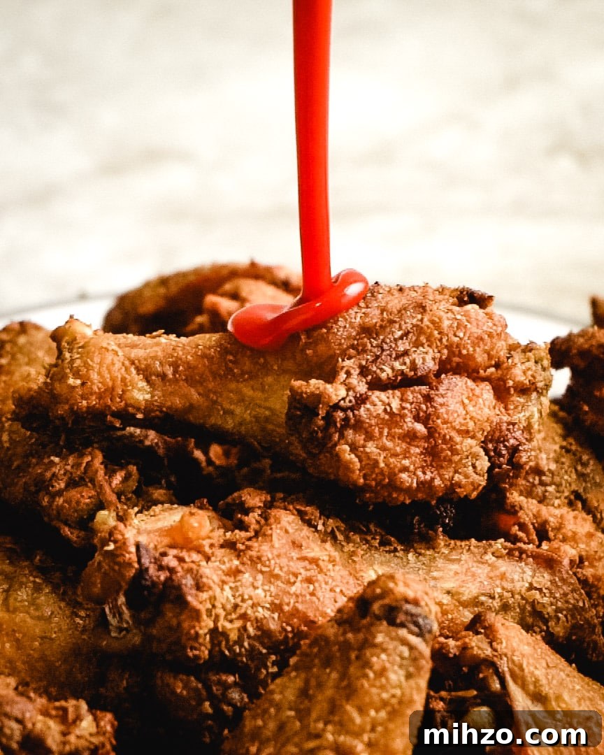 These Crispy Baked Chicken Wings are so shatteringly crisp that your guests will hardly believe that they’ve never been battered, breaded, or fried. This healthier and hassle-free recipe is a major must-make recipes for parties, and it’s all thanks to one simple, special ingredient. | hostthetoast.com img 13878 3