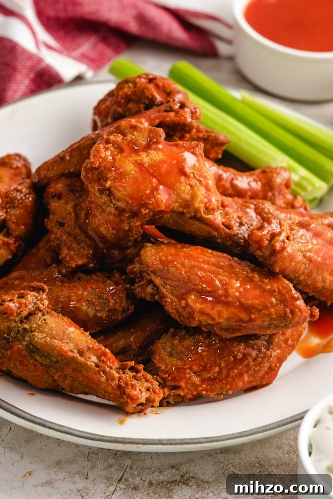 These Crispy Baked Chicken Wings are so shatteringly crisp that your guests will hardly believe that they’ve never been battered, breaded, or fried. This healthier and hassle-free recipe is a major must-make recipes for parties, and it’s all thanks to one simple, special ingredient. | hostthetoast.com img 13878 5