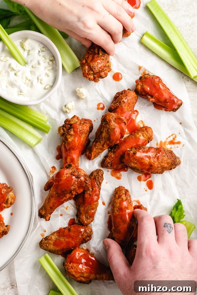 These Crispy Baked Chicken Wings are so shatteringly crisp that your guests will hardly believe that they’ve never been battered, breaded, or fried. This healthier and hassle-free recipe is a major must-make recipes for parties, and it’s all thanks to one simple, special ingredient. | hostthetoast.com img 13878 6