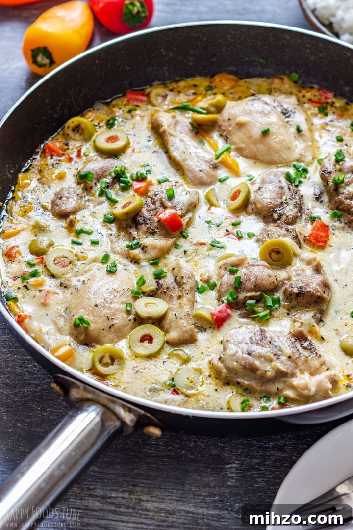 Creamy Garlic Boneless Skinless Chicken Thighs Recipe 2 Creamy boneless skinless chicken thighs in a skillet with olives, peppers and chives in a rich sauce.