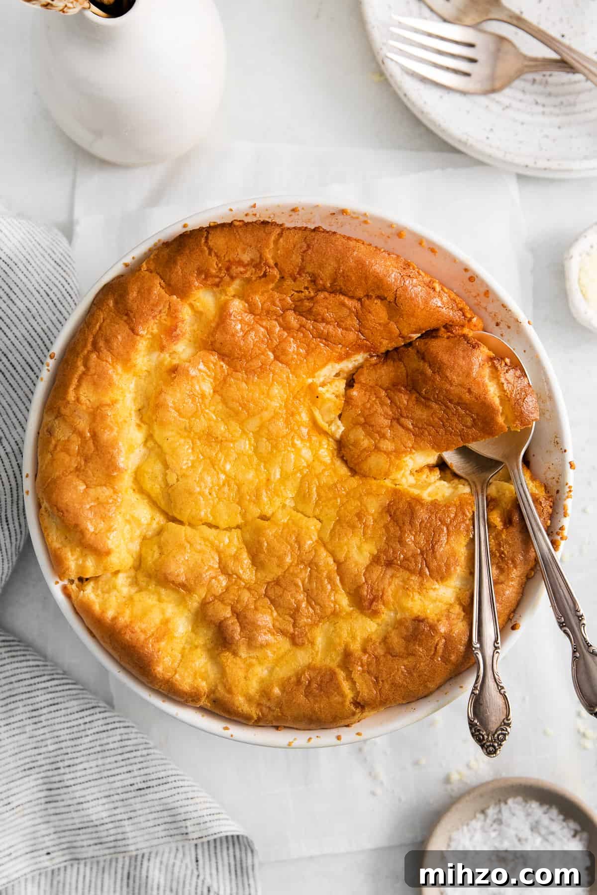 Cheese souffle in a round casserole dish.