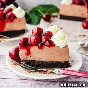 Slice of black forest cheesecake on a plate with a fork.