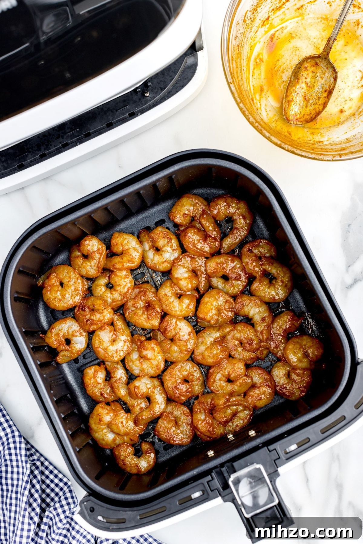 Crispy Air Fryer Shrimp Tacos with Lime Slaw and Spicy Mayo 6 Seasoned shrimp in the air fryer basket