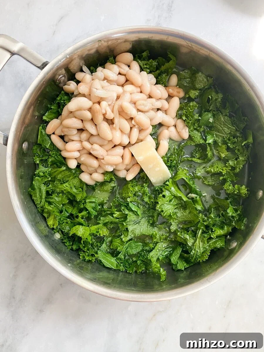 Adding the beans and a chunk of parmigiano parmesan cheese.