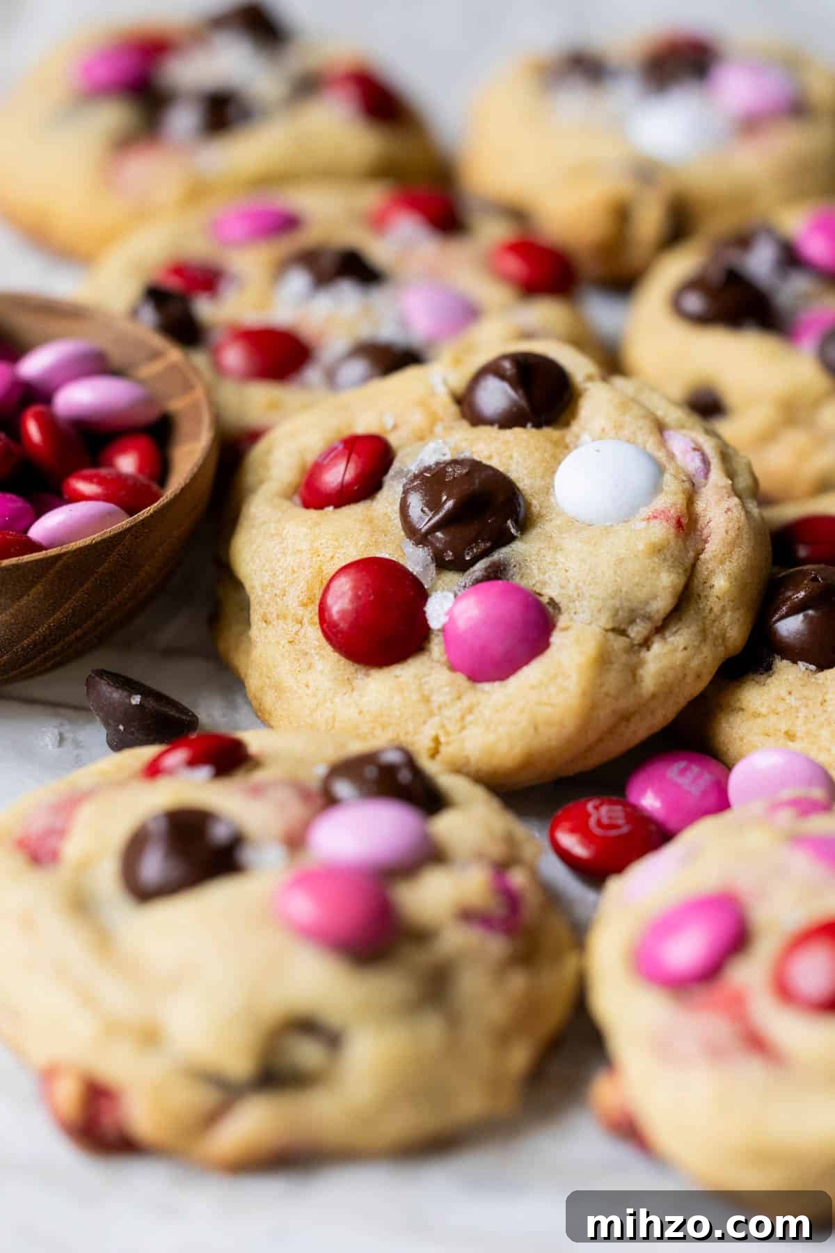 Valentine’s Day M&M Cookie Recipe: Festive Chocolate Cookies 2 cookies with m&ms and chocolate chips.