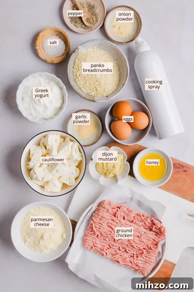 Ingredients for cauliflower chicken nuggets on a countertop with labels.