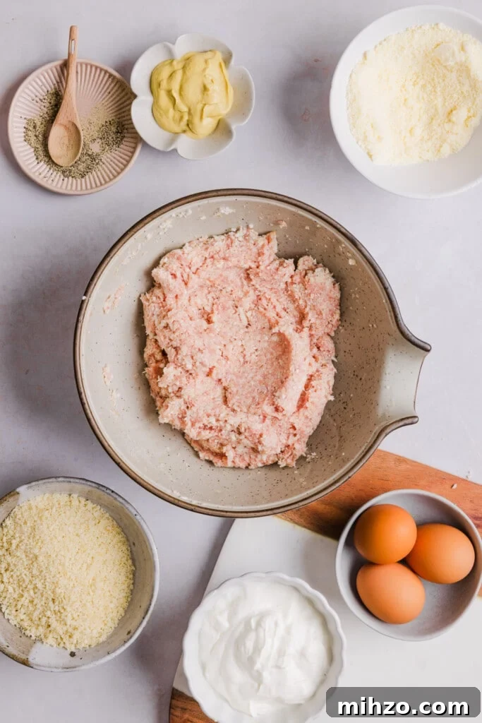 Cauliflower chicken nuggets ingredients mixed in a bowl.