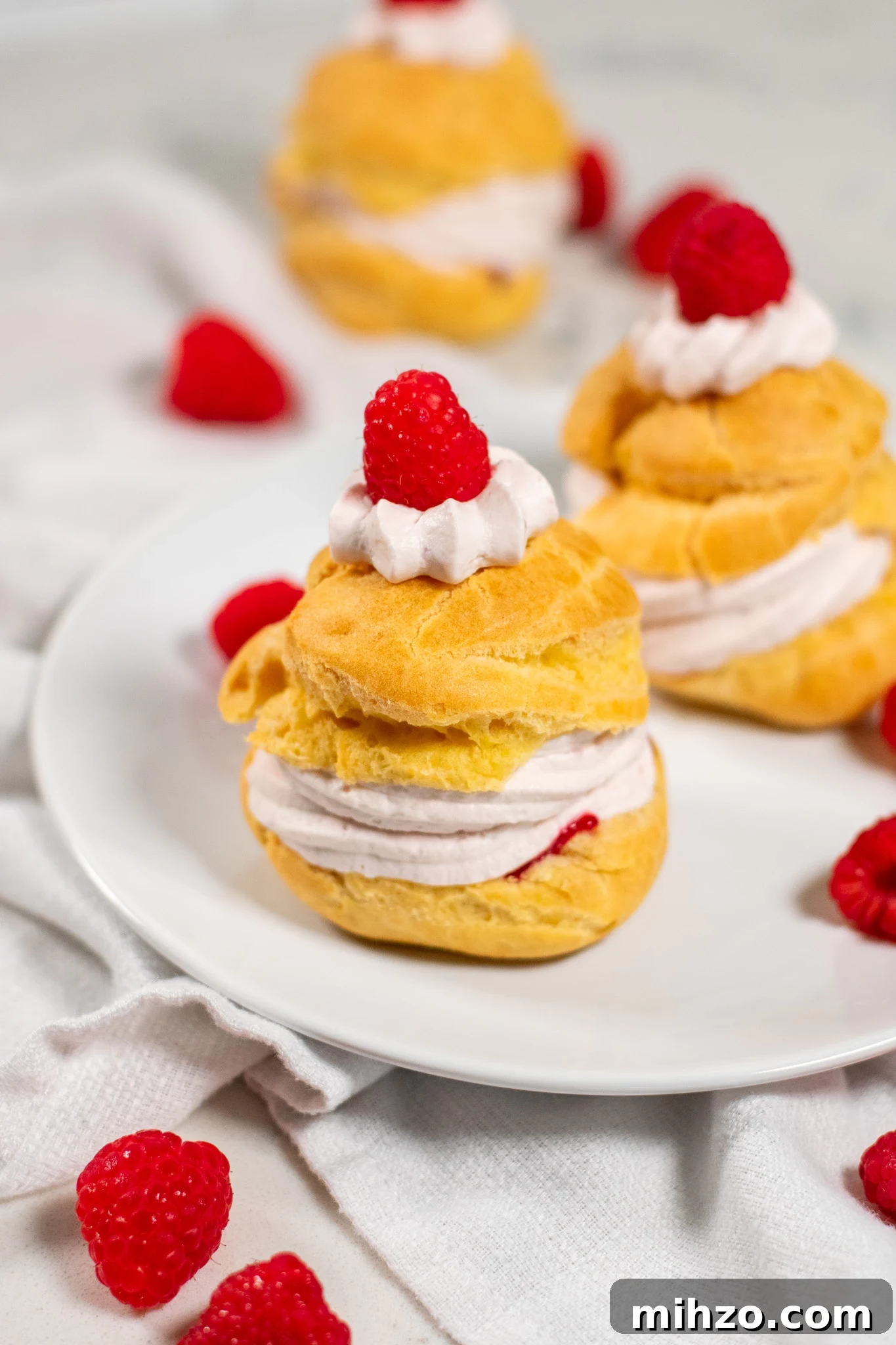 Raspberry Choux Pastry Fastelavnsboller Recipe 7 A choux pastry bun filled with raspberry cream cheese whipped cream and raspberry jam.