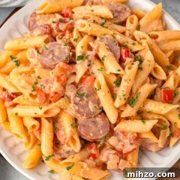 Creamy Kielbasa and Smoked Sausage Pasta Skillet Recipe 17 Creamy Kielbasa pasta with penne, diced pepper, sliced smoked sausage, parmesan, and a cream sauce.
