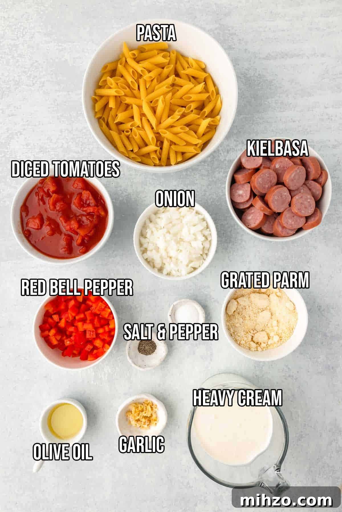 Creamy Kielbasa and Smoked Sausage Pasta Skillet Recipe 3 Creamy kielbasa pasta ingredients: penna pasta, kielbasa, olive oil, onion, red bell pepper, garlic, diced tomatoes, heavy cream, parmesan, salt and pepper.
