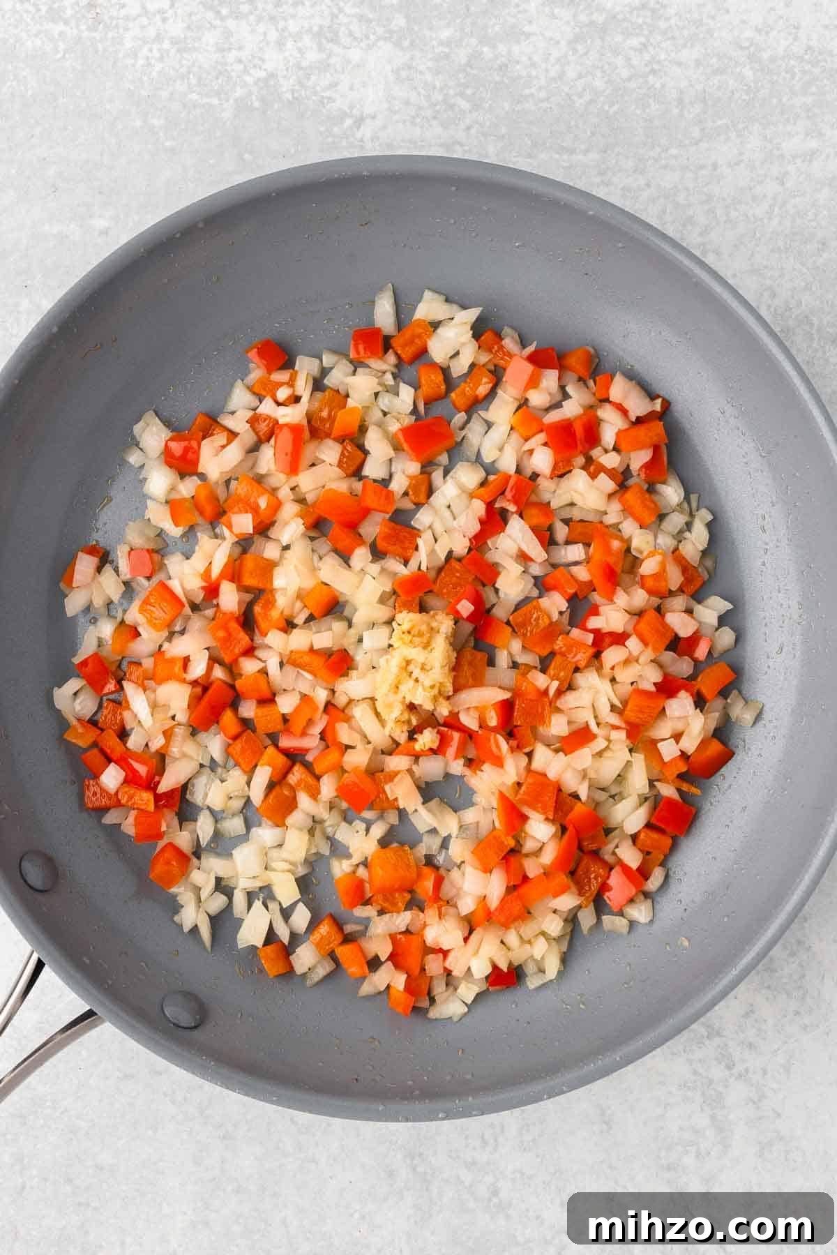 Creamy Kielbasa and Smoked Sausage Pasta Skillet Recipe 5 The veggies are cooked until tender in a large skillet.