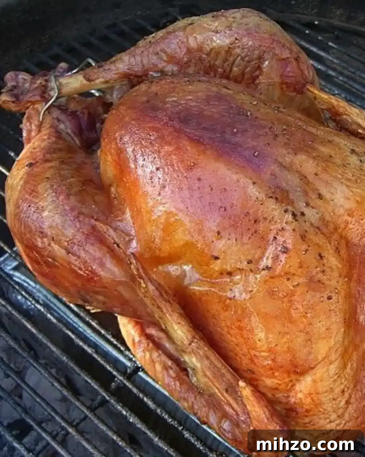 Grilling a Whole Turkey on Charcoal or Gas: Step-by-Step Guide 2 a whole grilled turkey on a Weber charcoal grill.