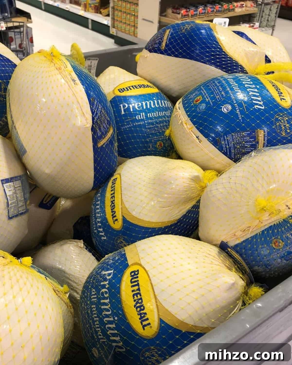 Grilling a Whole Turkey on Charcoal or Gas: Step-by-Step Guide 3 large bin of frozen turkeys at the grocery store.