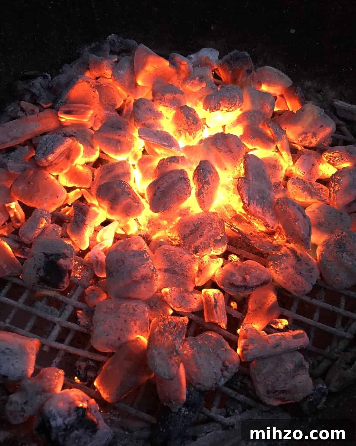 Grilling a Whole Turkey on Charcoal or Gas: Step-by-Step Guide 5 red hot charcoal in a Weber grill.